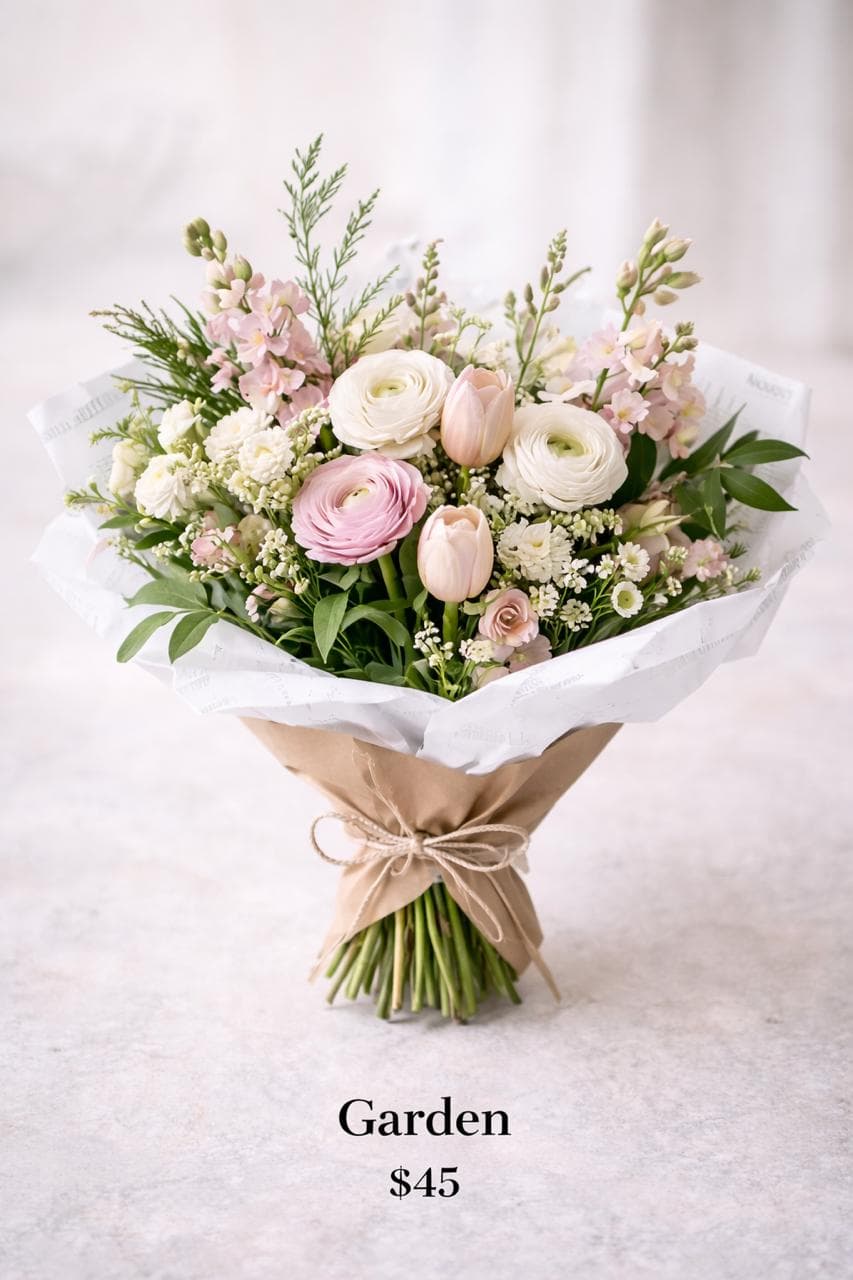 Garden tier bouquet with balanced fullness and layered pastel blooms.